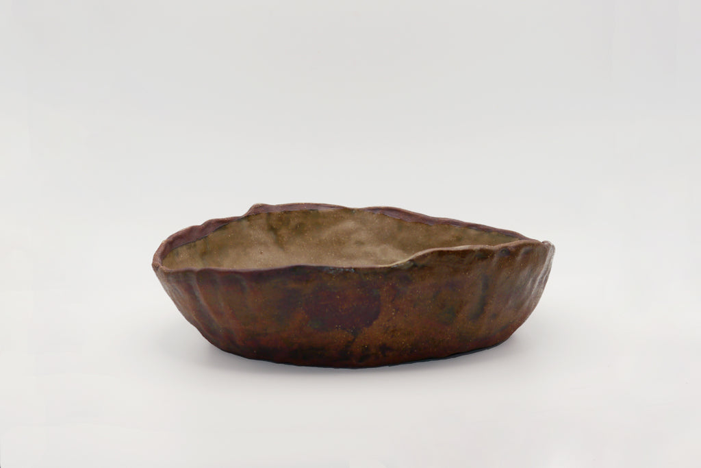 Rustic ceramic bowl on a white background