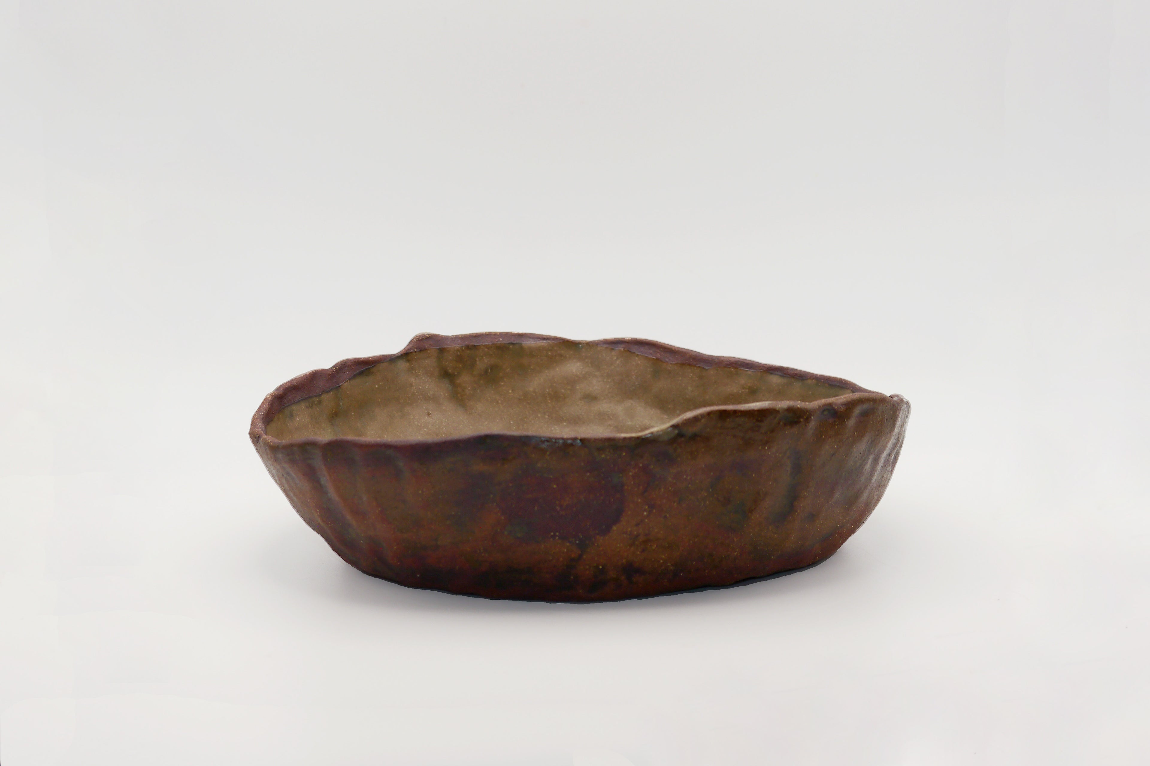 Rustic ceramic bowl on a white background